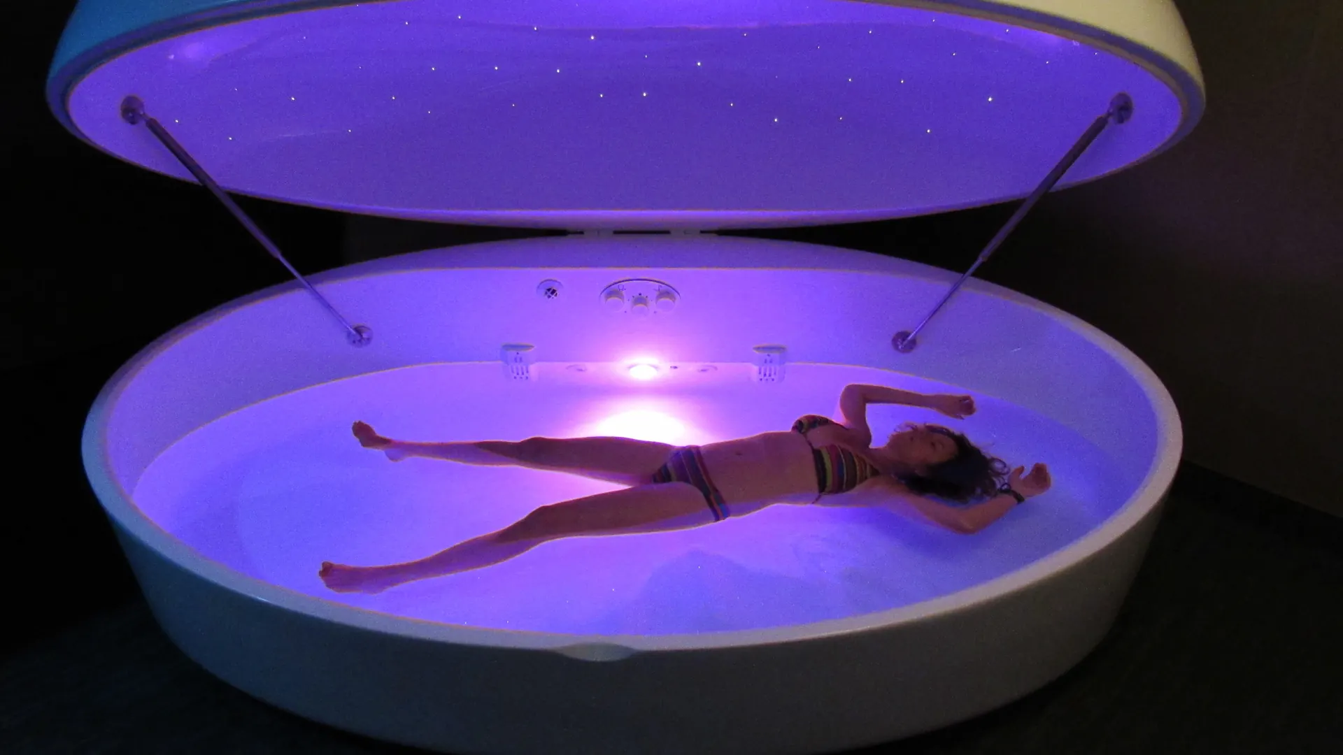 Float pod suite glowing violet at CHILL on Del Prado