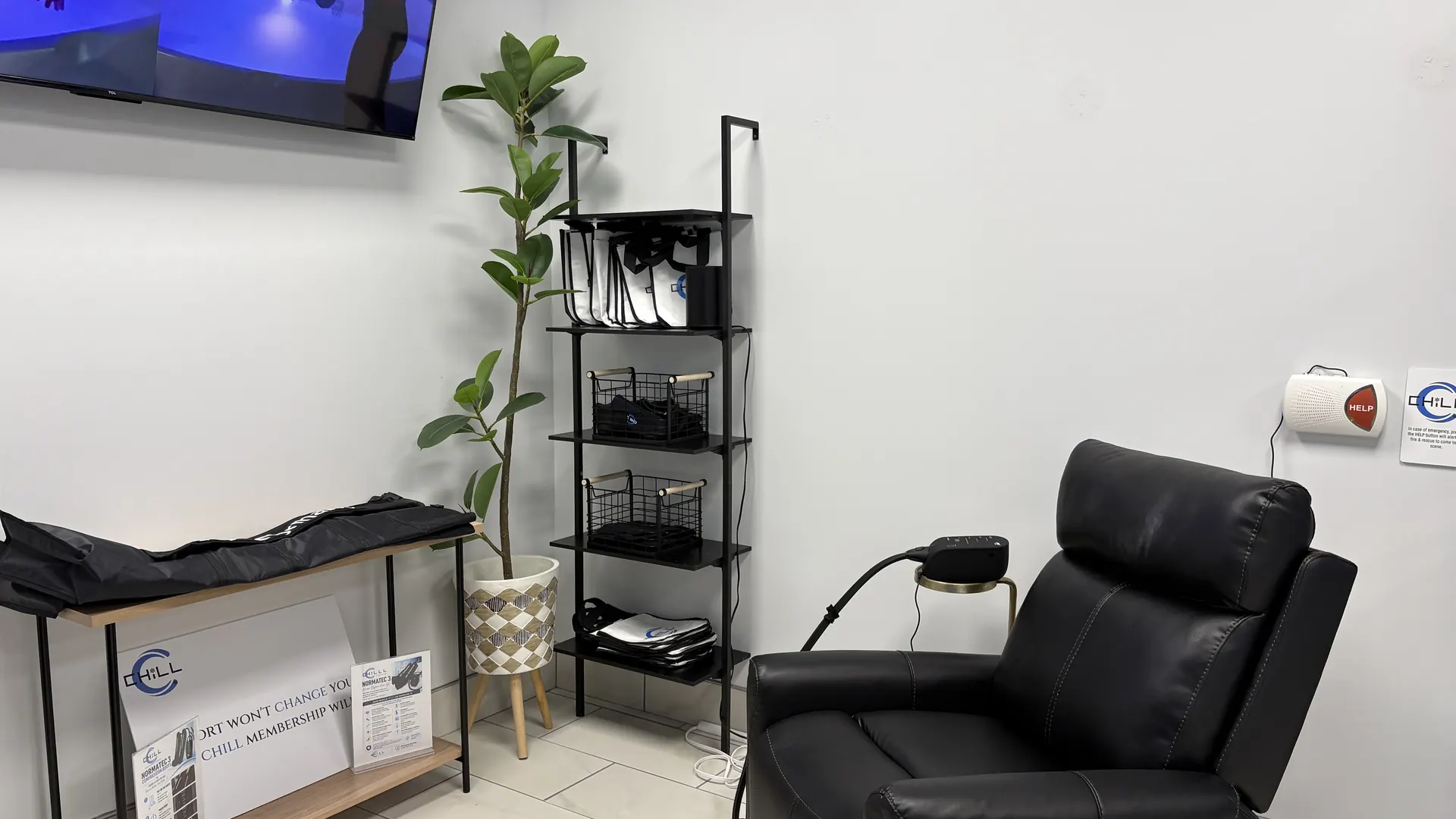 Normatec compression station with recliner at CHILL